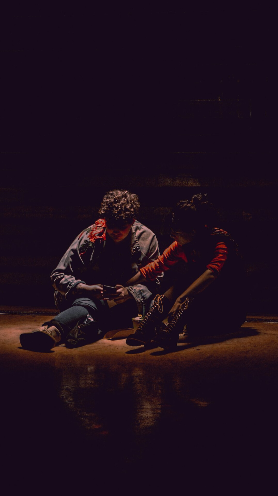 Two actors rehearsing a dramatic scene together on stage