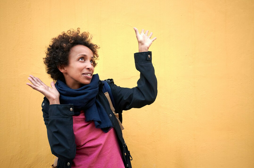 Woman practicing a confident public speaking gesture